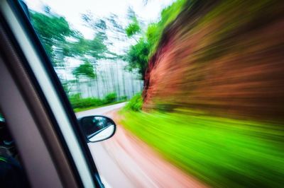 Blurred motion of car on road