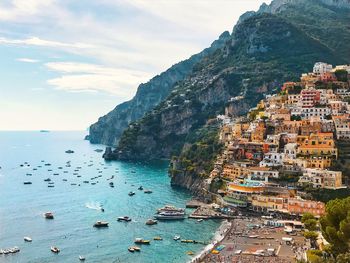 Scenic view of sea and houses on mountain 