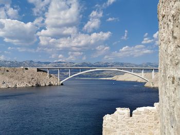 Bridge over sea against sky