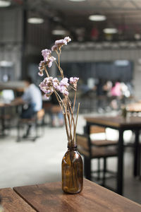 Close-up of flower vase on table