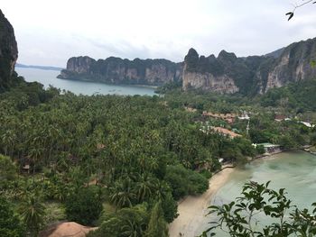 Scenic view of sea and mountains against sky