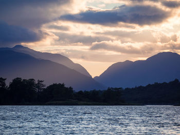 Scenic view of lake against sky during sunset