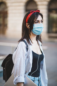 Portrait of woman standing outdoors