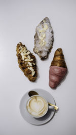 Directly above shot of coffee on table against white background
