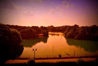 Scenic view of lake against sky during sunset