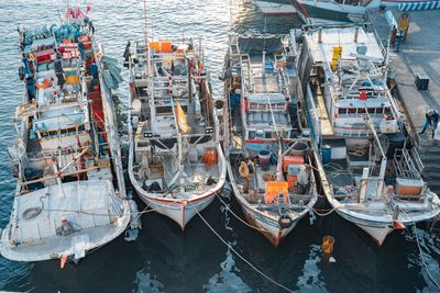 High angle view of boats moored at harbor