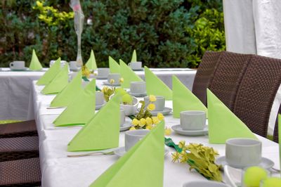 Cups and napkins arranged on table