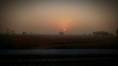 Scenic view of landscape at sunset