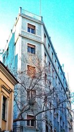 Low angle view of building against blue sky