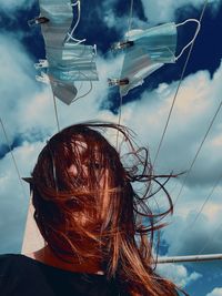 Portrait of woman against sky