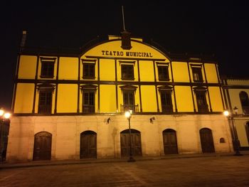 Buildings in city at night