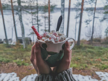 Midsection of person holding ice cream cone