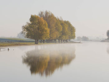 Scenic view of lake against sky during autumn