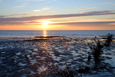 Scenic view of sea against sky during sunset