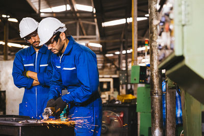 Manual workers working in factory