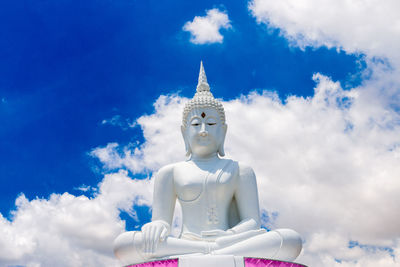 Low angle view of statue against blue sky