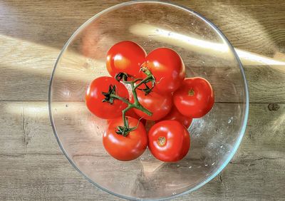 High angle view of tomatoes in container on table