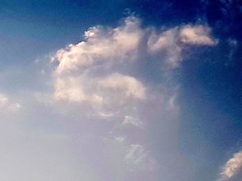 Low angle view of rainbow in sky