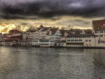 Buildings against cloudy sky