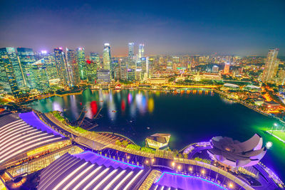 High angle view of illuminated buildings in city at night