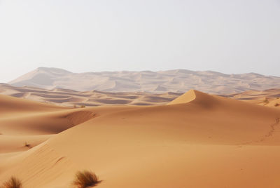 Scenic view of desert against clear sky