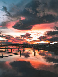 Scenic view of lake against romantic sky at sunset