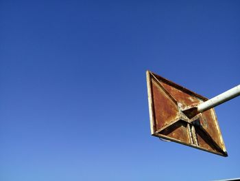 Low angle view of lighthouse against clear blue sky