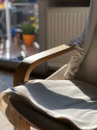 Close-up of woman sitting on chair