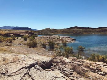 Scenic view of land against clear blue sky
