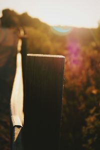 Close-up of wood against sky during sunset