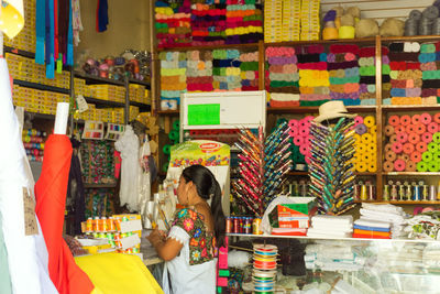 Woman standing at market stall