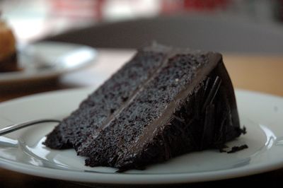 Close-up of chocolate cake slice in plate on table