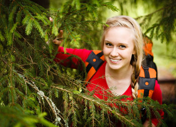 Portrait of smiling young woman in field