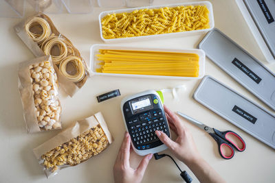 High angle view of woman preparing food on table