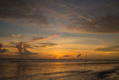 Scenic view of sea against sky at sunset