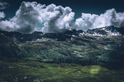 Towering clouds over the mountains during an hike italy alps