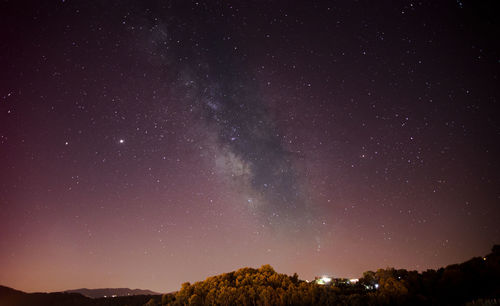 Scenic view of star field against sky at night