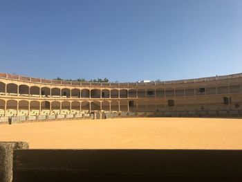 Low angle view of historical building against clear blue sky