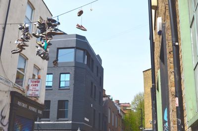 Low angle view of buildings against blue sky