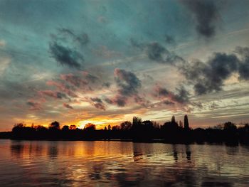Scenic view of lake at sunset