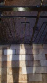 Close-up of shadow on tiled floor