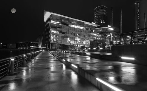 Reflection of illuminated buildings in water at night