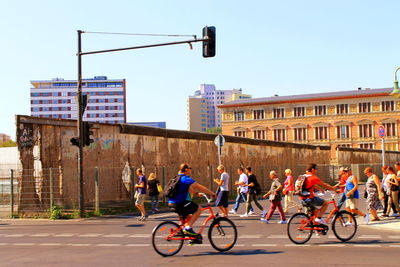People riding bicycle on city street