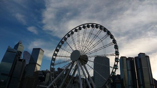 Low angle view of ferris wheel against sky