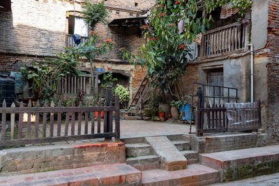 Rear view of woman sitting on steps