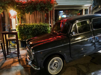 Vintage car on table at night