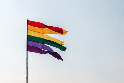 Low angle view of flag against clear sky