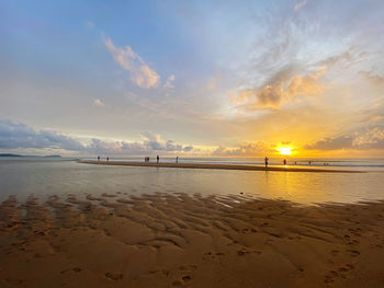 Scenic view of beach during sunset