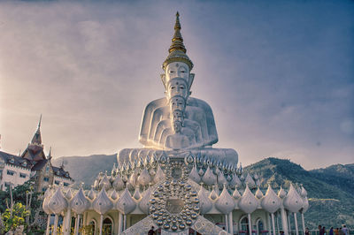 Buddha statues against sky