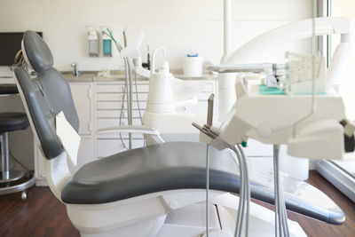 Empty dentist chair with equipment at clinic